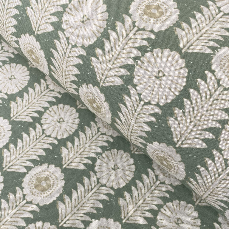 A folk-inspired block print style design with a stylised floral motif in green. A versatile mid scale design suitable for curtains and blinds.