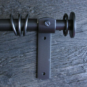 a slim dark metal curtain pole