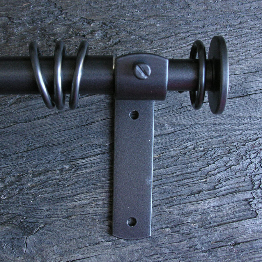 a slim dark metal curtain pole