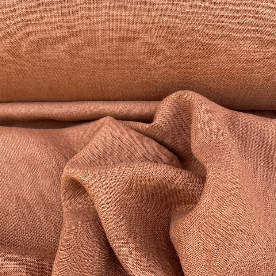 100% Linen fabric with a super soft drape in a soft terracotta. This mid weight linen is suitable for curtains and blinds where a good drape is uppermost.