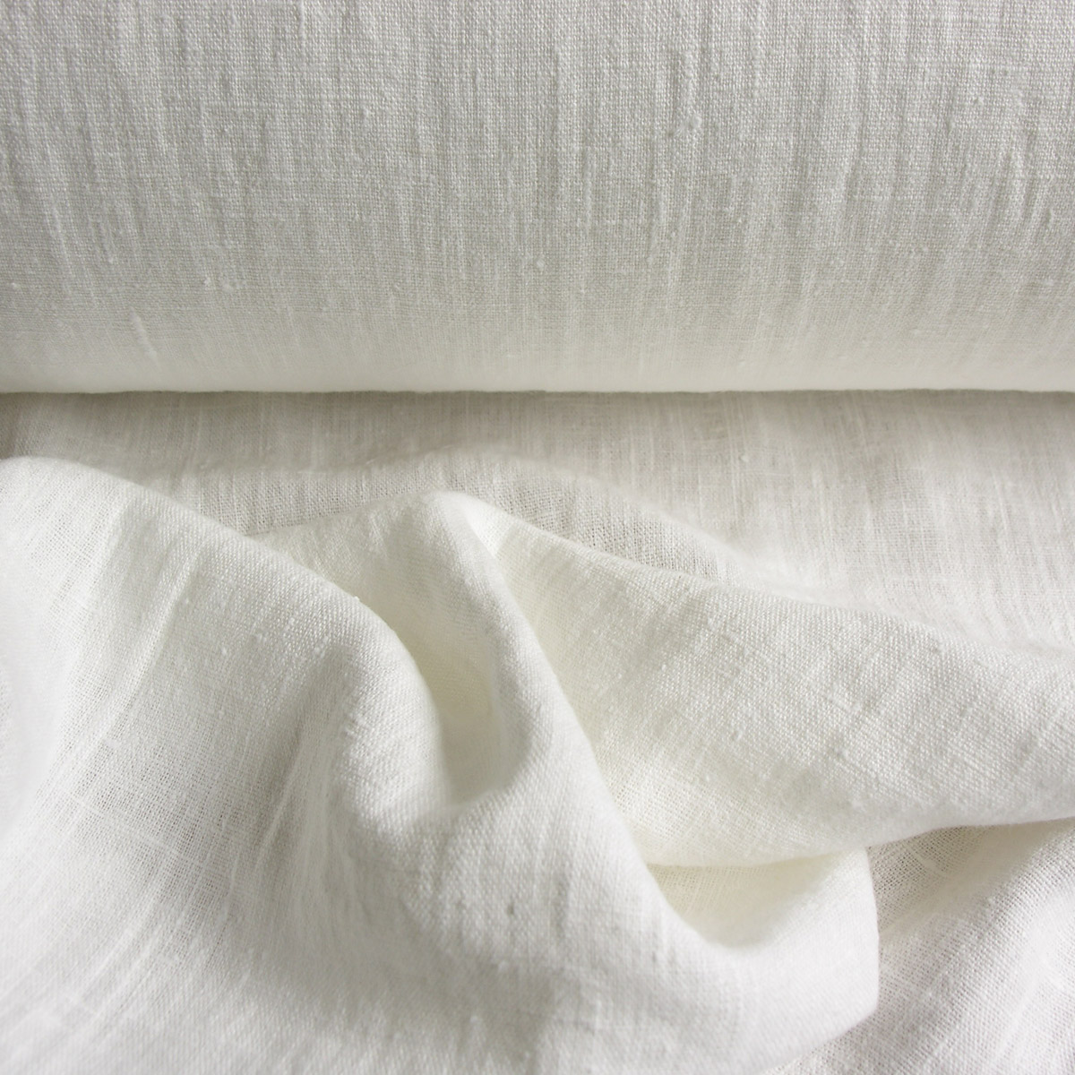 100% Linen fabric with a super soft drape, in a white just off bright white.
