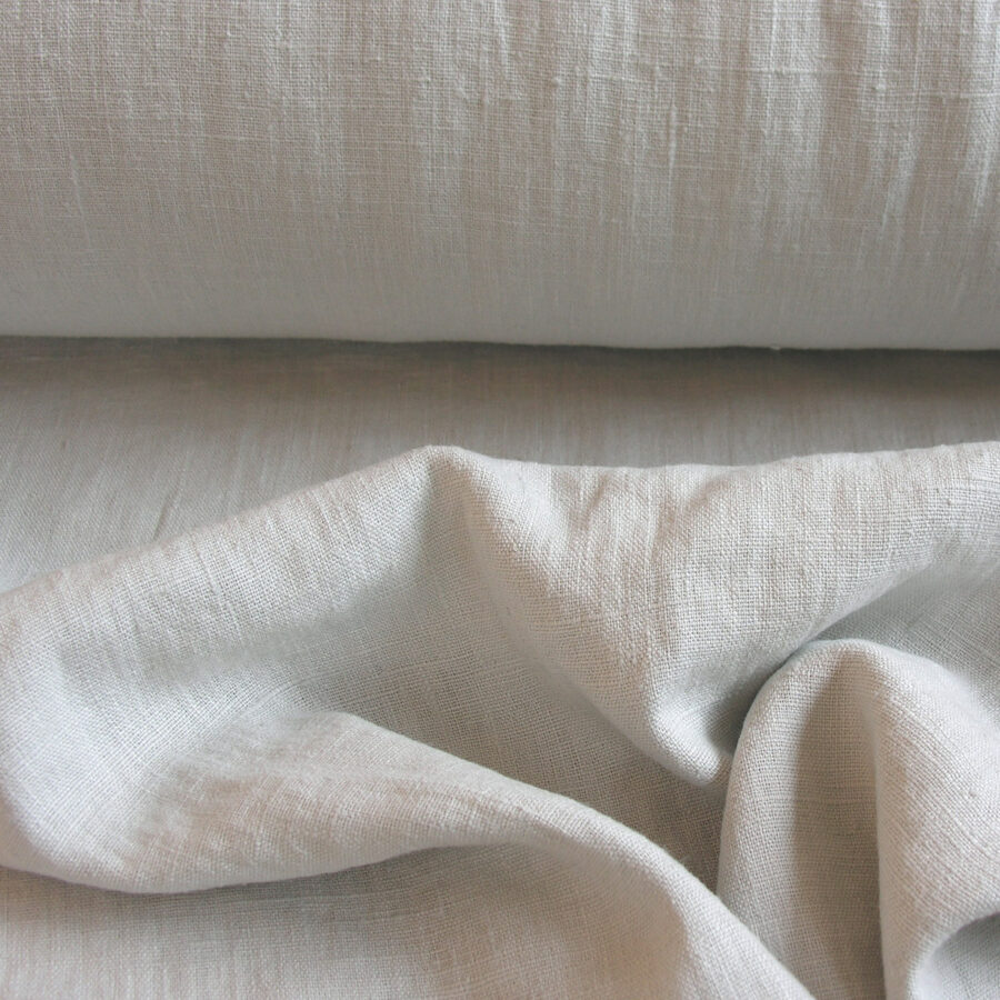 Linen fabric with a super soft drape, in a pale putty grey.