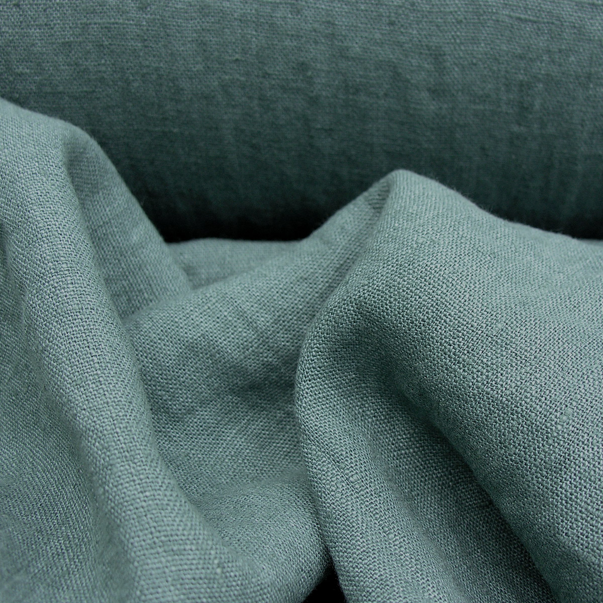 100% Linen fabric with a super soft drape in a teal blue/green. This mid weight linen is suitable for curtains and blinds where a good drape is uppermost.