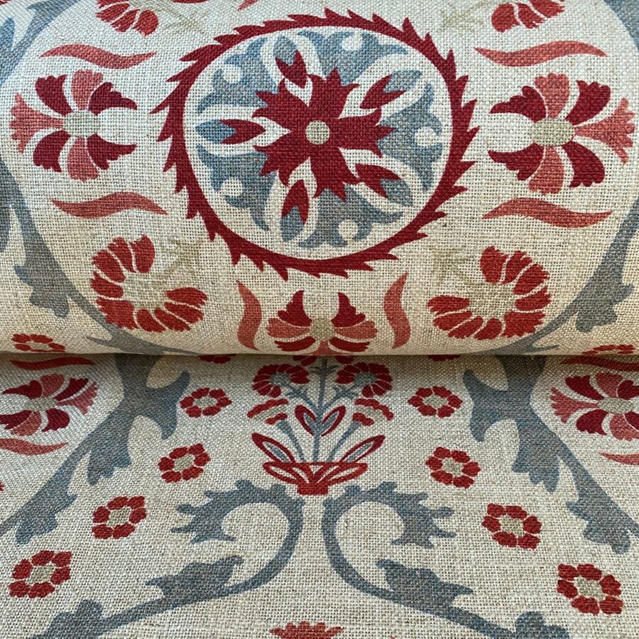 Tinsmiths Extra Wide Suzani print cloth on a roll in Strawberry & Duckegg