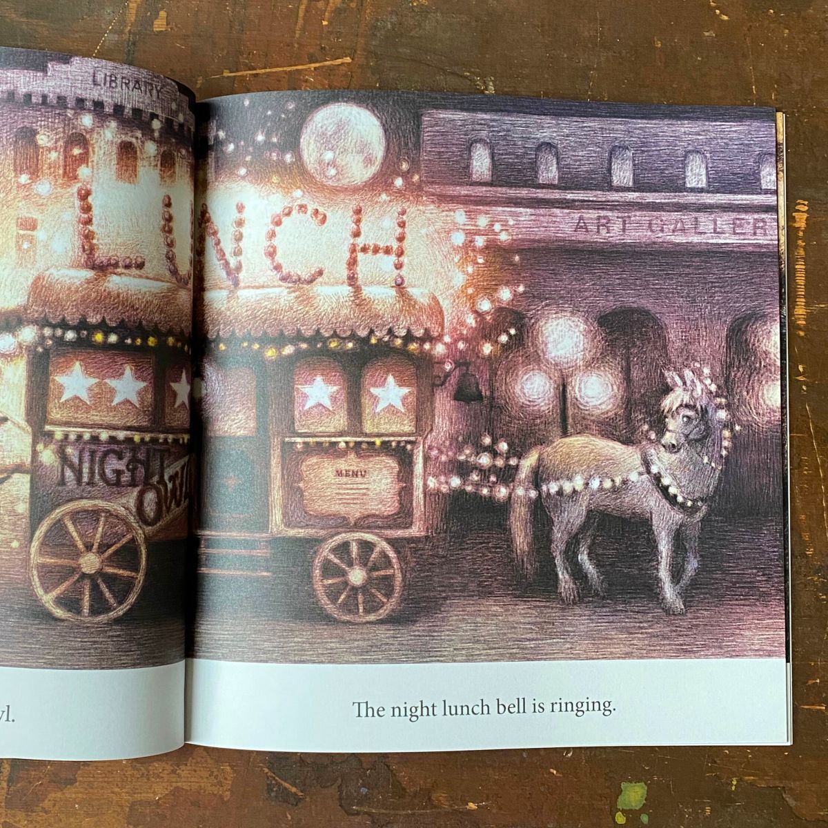 Double page spread of a horse and carriage from Night Lunch book by Eric Fan