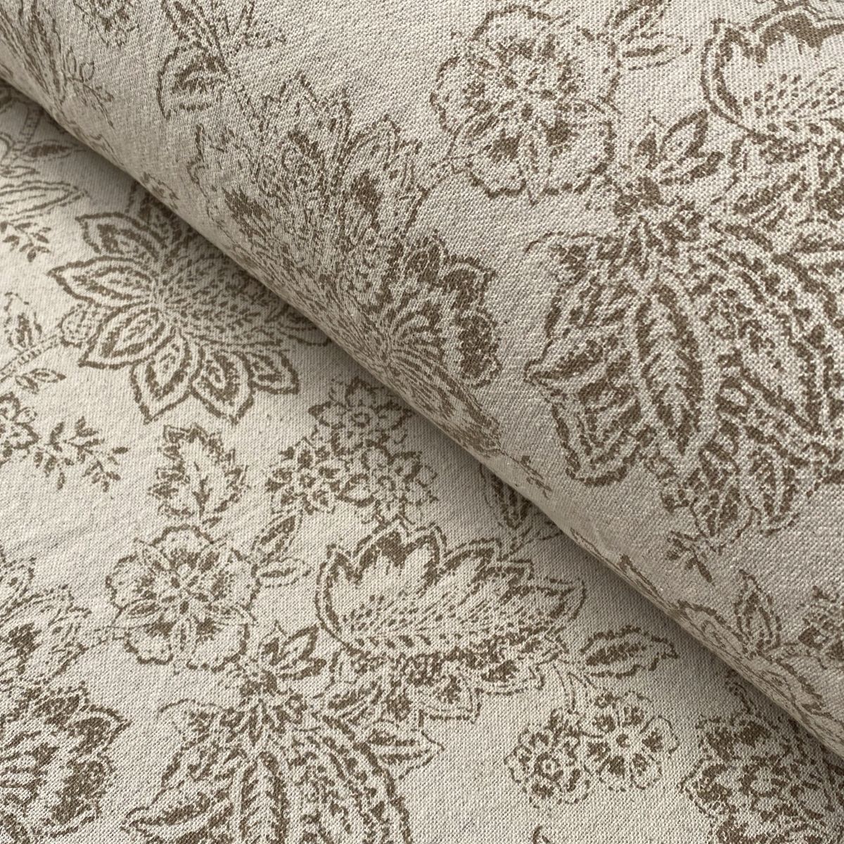Tree of Life patterned fabric on a slanted roll