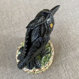 Ceramic slipware black crow on a patterned plinth by Paul Young