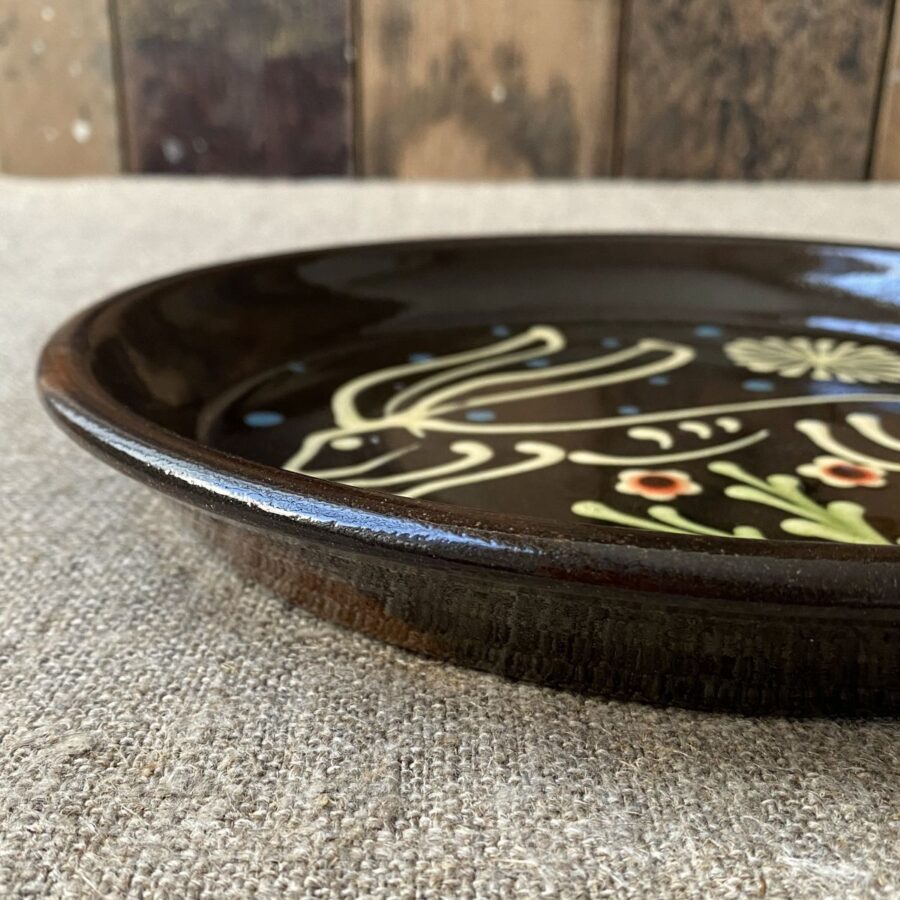 Ceramic slipware plate with a hare design by Paul Young