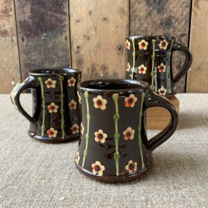 Trio of Paul Young Blossom-sprigged black Mugs