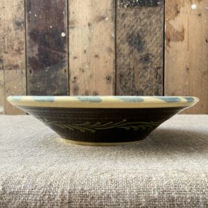 Highly detailed, ceramic slipware daisy bowl by Paul Young