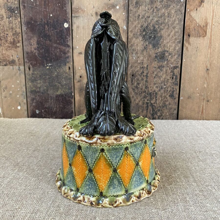 Ceramic slipware black crow on a patterned plinth by Paul Young