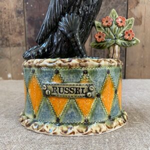 Ceramic slipware black crow on a patterned plinth by Paul Young