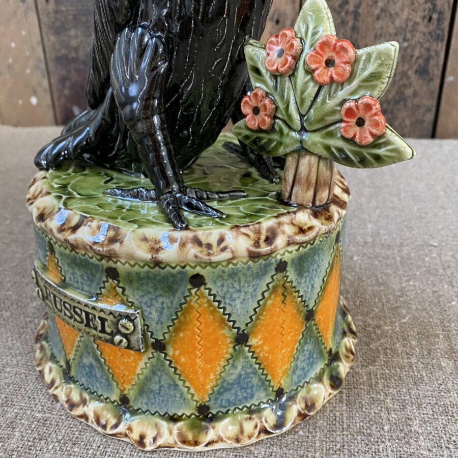 Ceramic slipware black crow on a patterned plinth by Paul Young