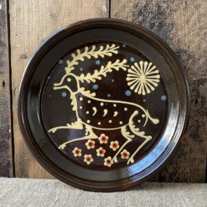 Ceramic slipware plate with a STAG design by Paul Young
