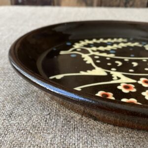 Ceramic slipware plate with a STAG design by Paul Young