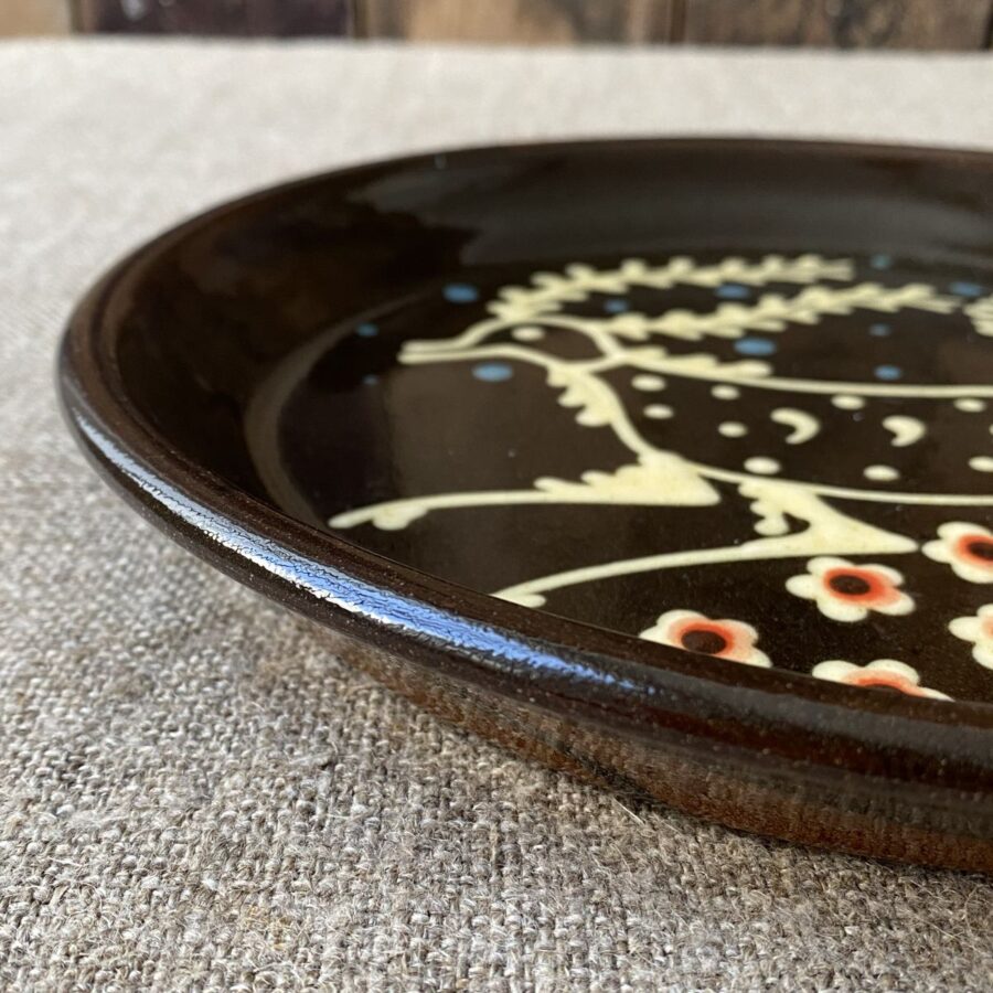 Ceramic slipware plate with a STAG design by Paul Young