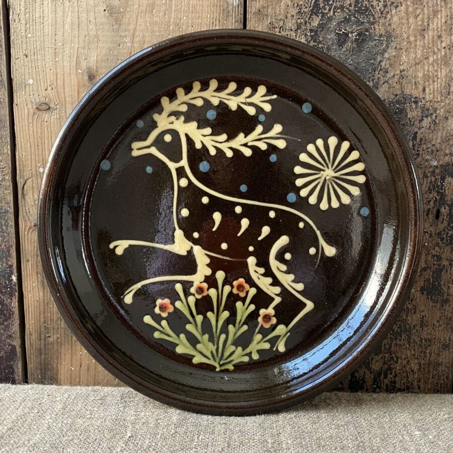 Ceramic slipware plate with a STAG design by Paul Young