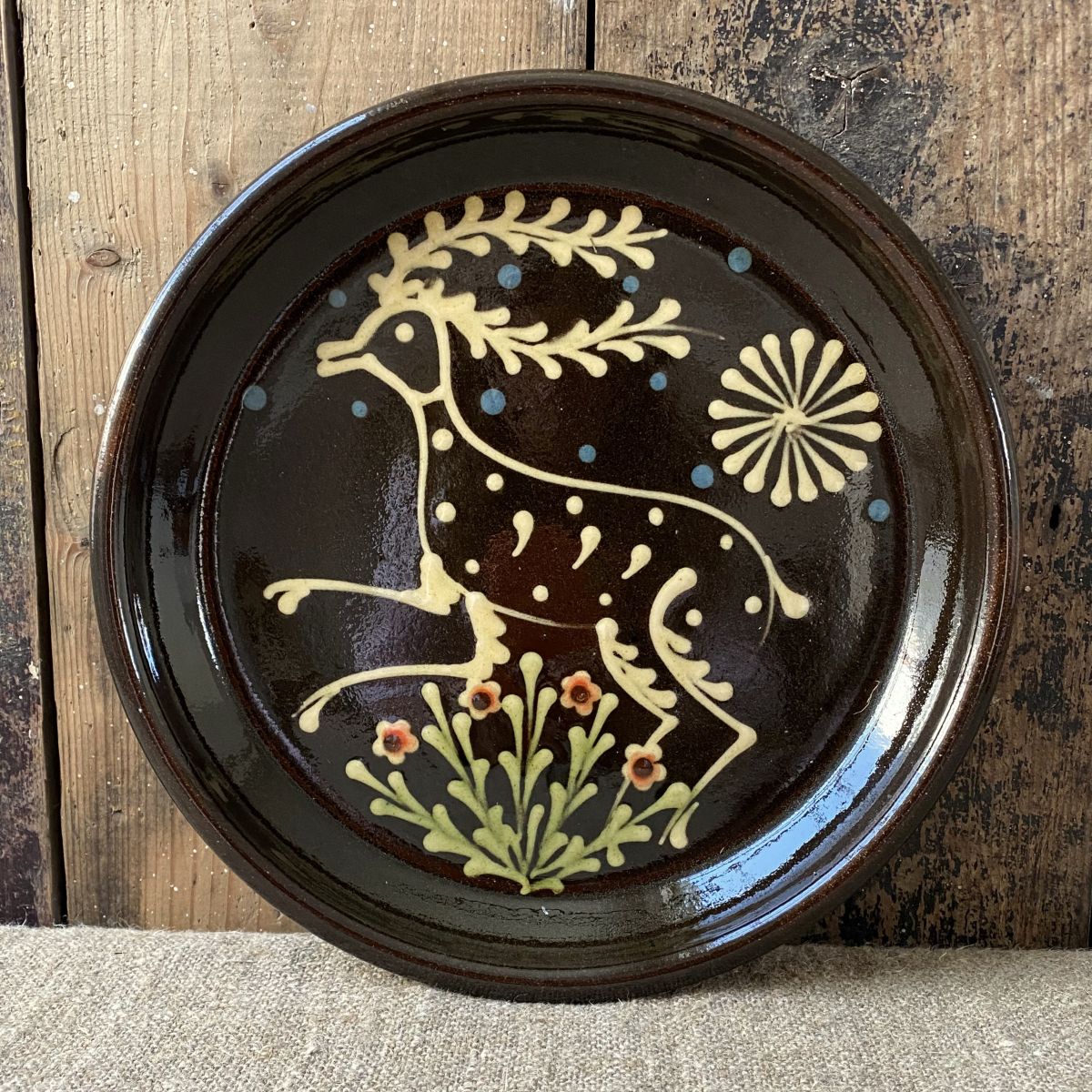 Ceramic slipware plate with a STAG design by Paul Young