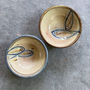 Slipware bowl taken from above on a stone floor