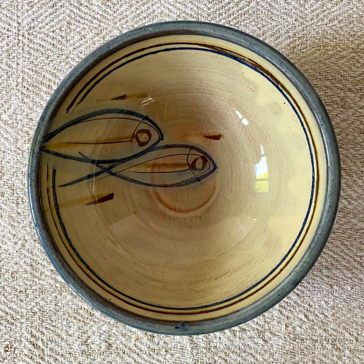 Jennifer Hall Cream Slipware bowl taken from above, on a cream backcloth