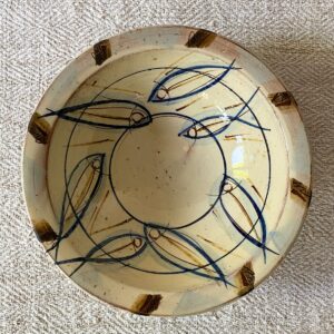 Jennifer Hall slipware breakfast bowls from above on a cream textile background