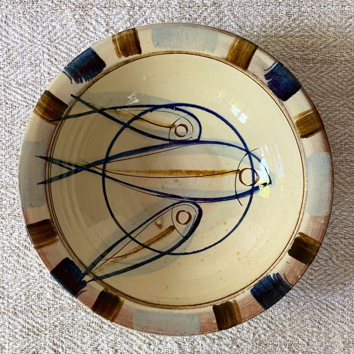 Jennifer Hall Slipware pasta bowl from above on a cream textile background