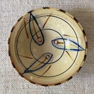 Jennifer Hall Slipware pasta bowl from above on a cream textile background