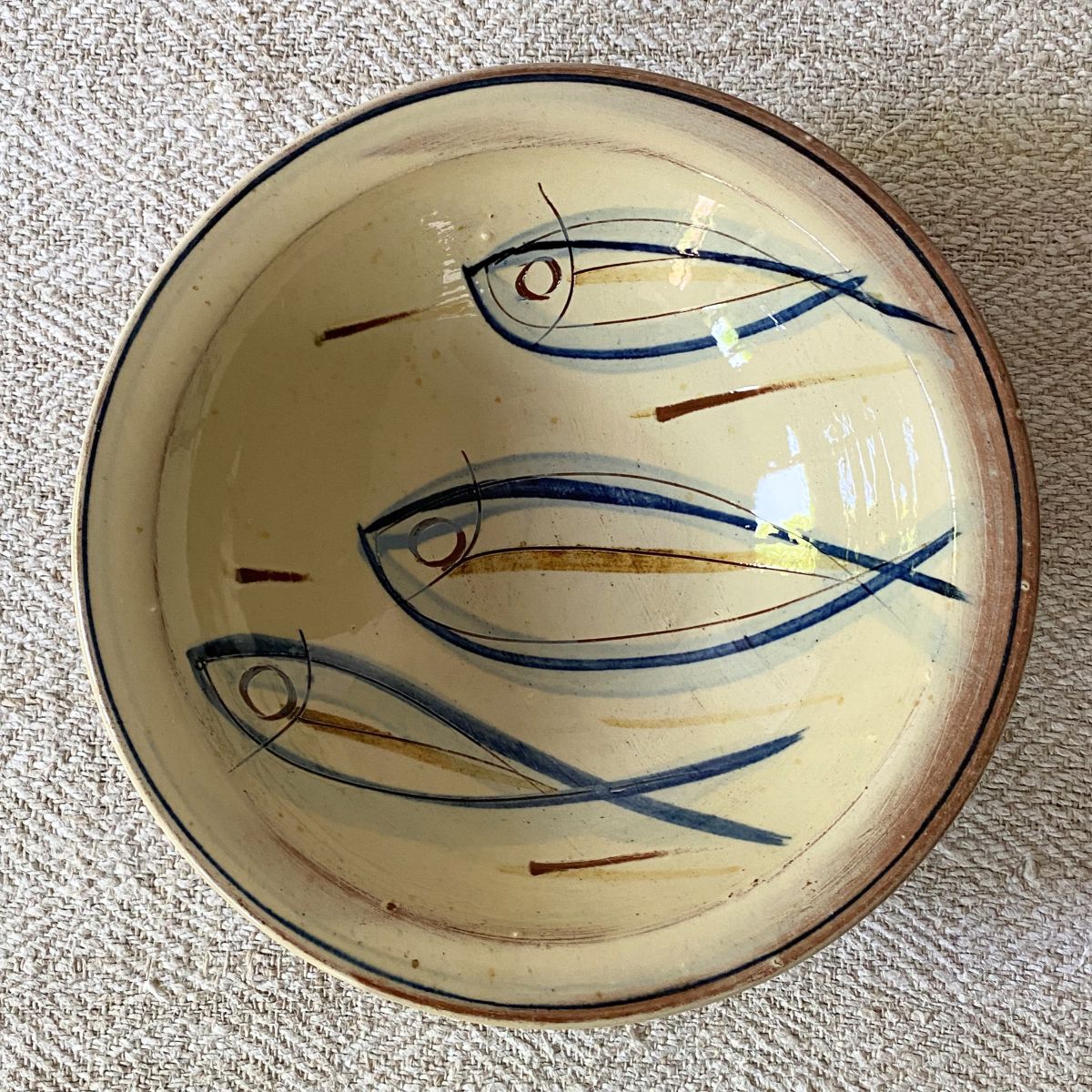 Jennifer Hall Slipware pasta bowl from above on a cream textile background