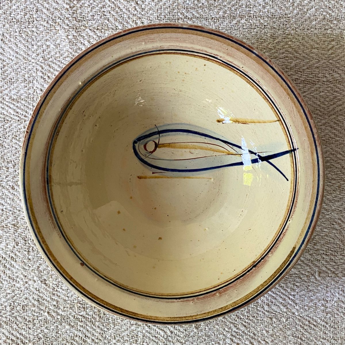 Jennifer Hall Slipware pasta bowl from above on a cream textile background