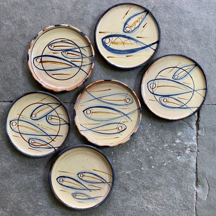 Jennifer Hall cream glazed side plates on stone background