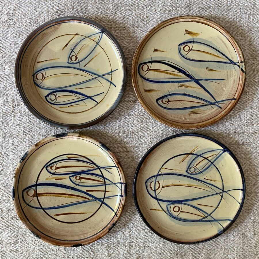 Four Jennifer Hall cream glazed side plates on cream backcloth