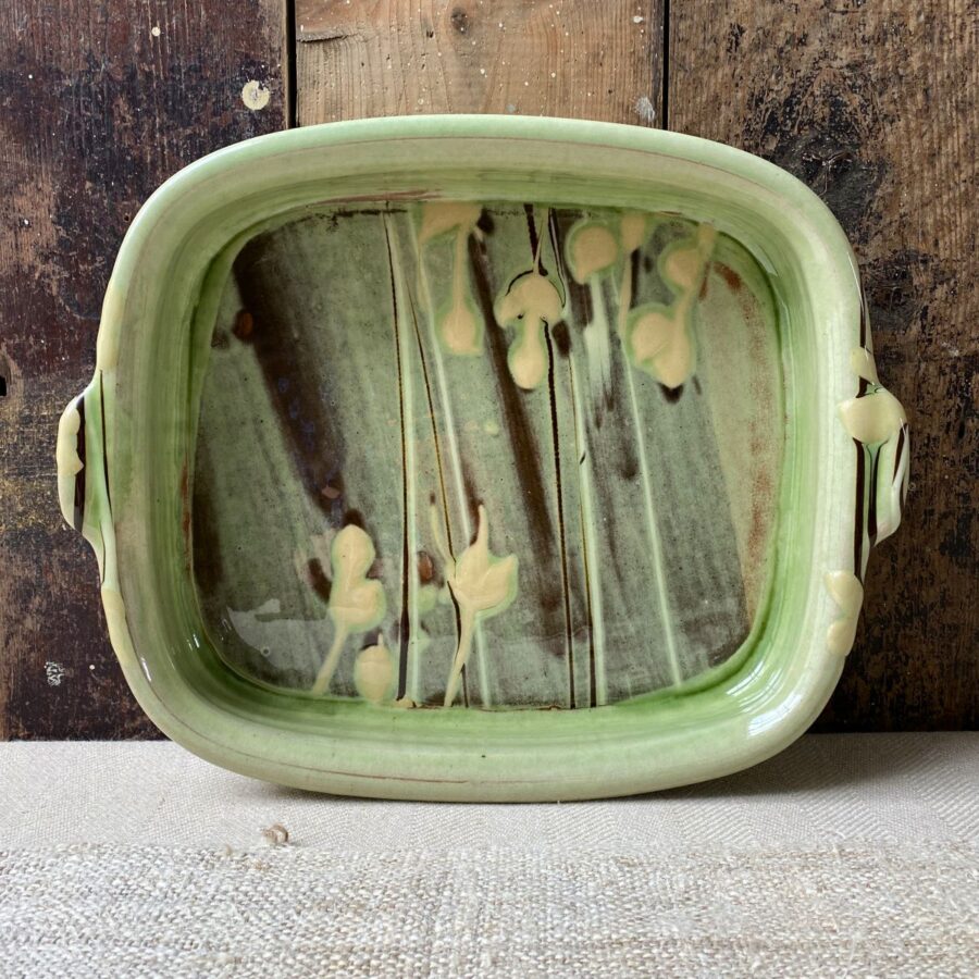 Patia Davis green glazed rectangular baking dish with wooden background