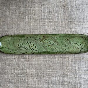 Patia Davis extra long oval platter with green glaze on linen backcloth