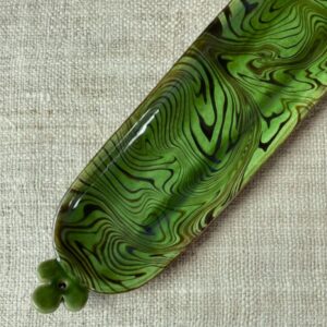 Patia Davis extra long oval platter with green glaze on linen backcloth