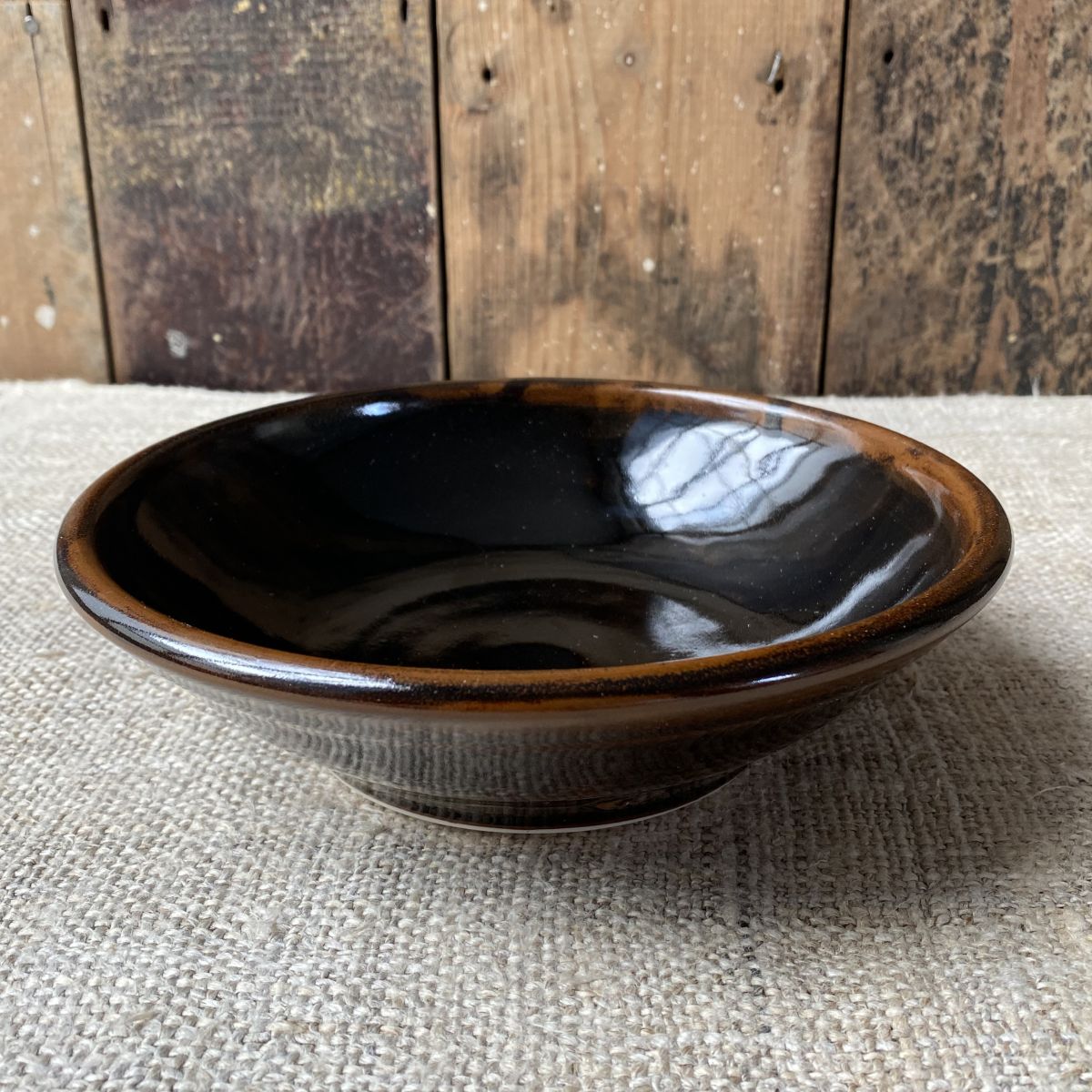 Stuart Houghton ceramic pasta bowl in a dark tenmoku glaze