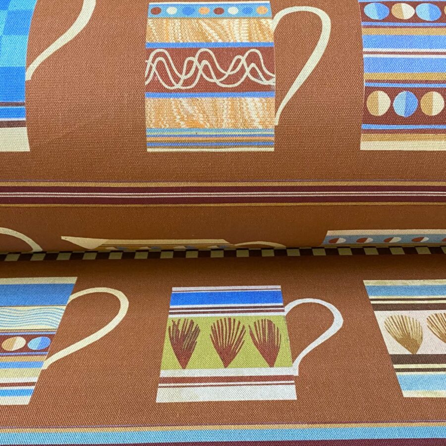 Marion Elliot design Mochaware fabric with brick background