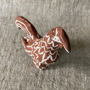 Emma Carlow Upright Cockerel clay whistle on cloth background