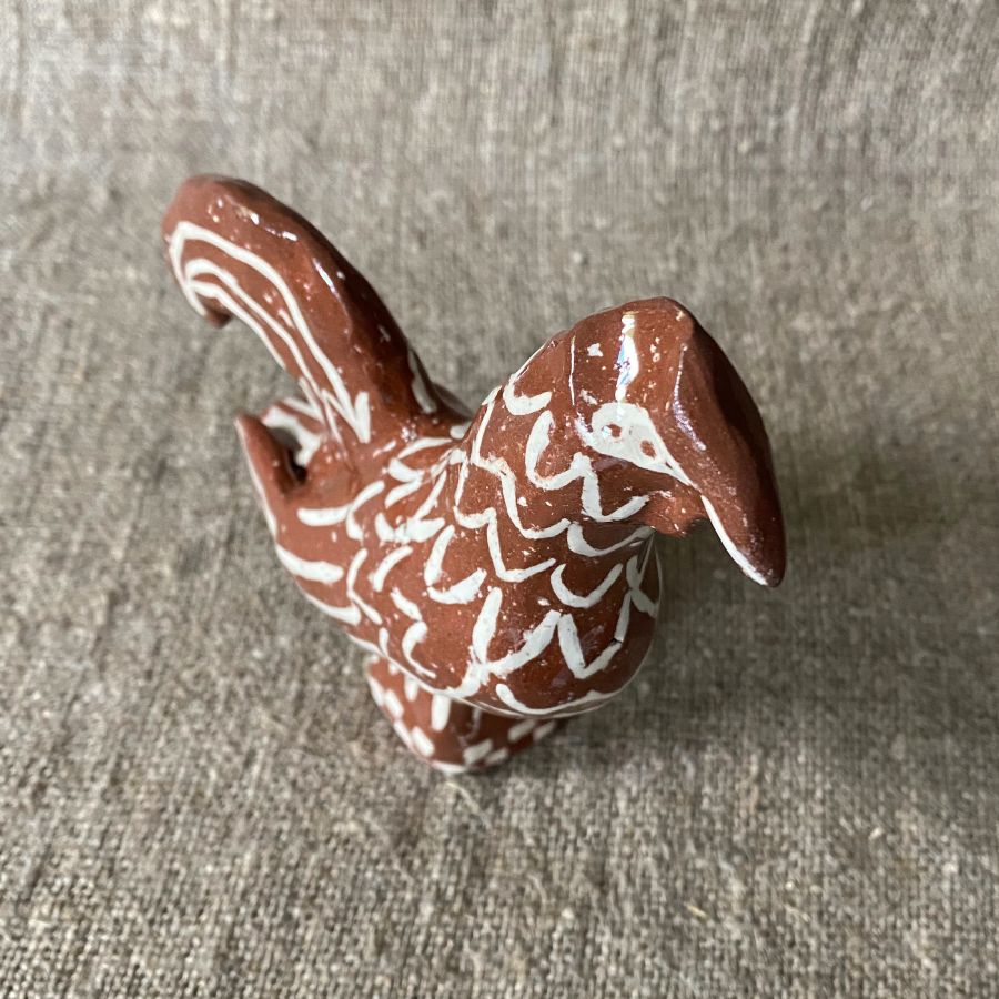 Emma Carlow Upright Cockerel clay whistle on cloth background