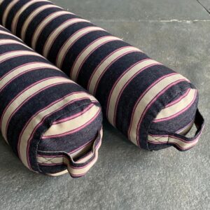 Pair of Striped Draught Excluders on a grey stone floor