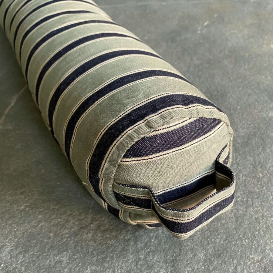 Striped Draught Excluder on a grey stone floor