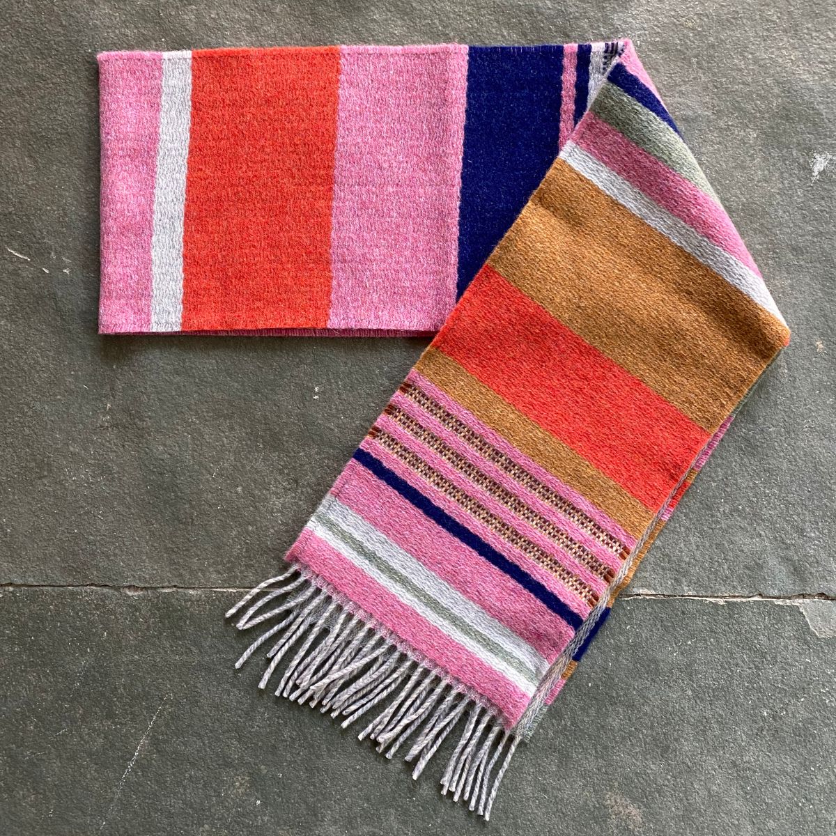 Wallace + Sewell Striped Scarf on a stone floor