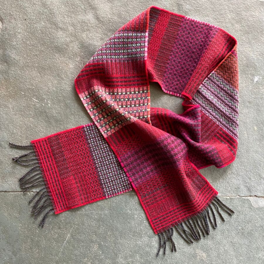 Wallace + Sewell striped wool scarf in a loop on a stone floor