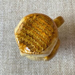 Pottery jug in shape of an ow, with a removable head