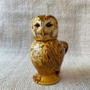Pottery jug in shape of an ow, with a removable head