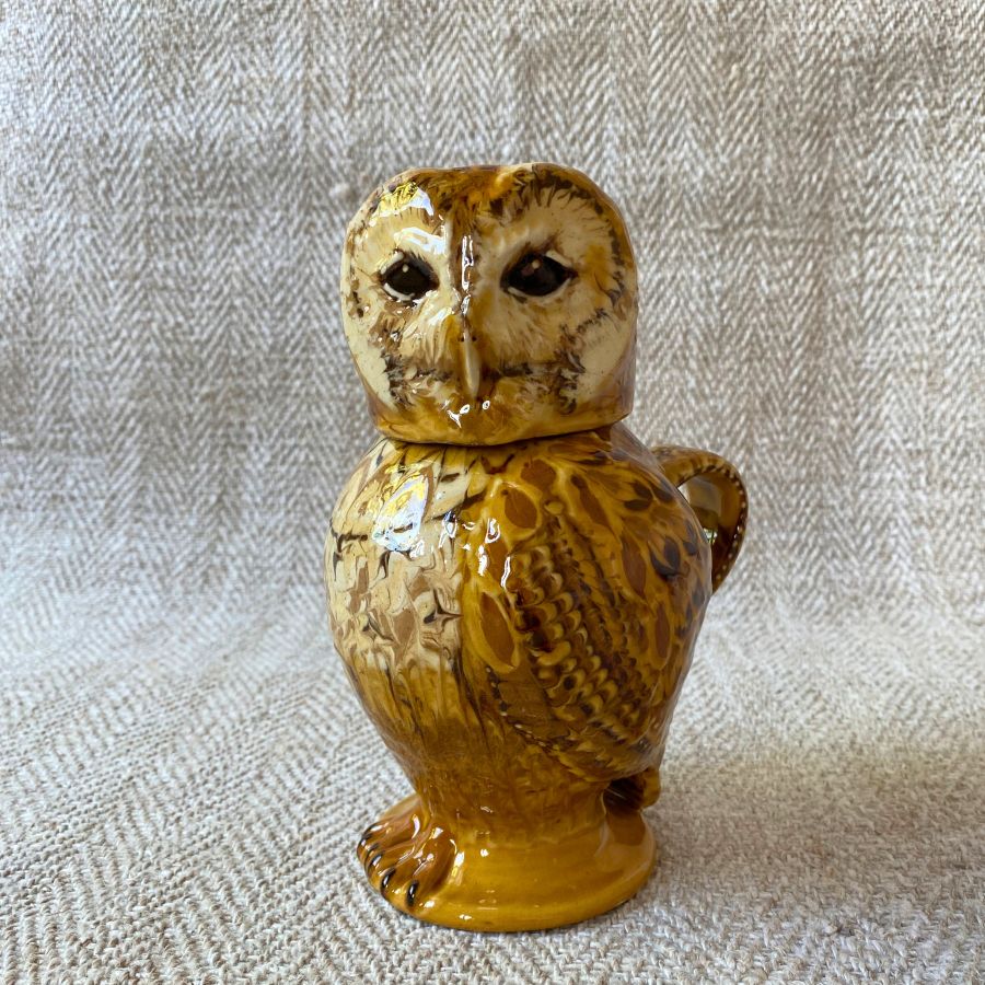 Pottery jug in shape of an ow, with a removable head