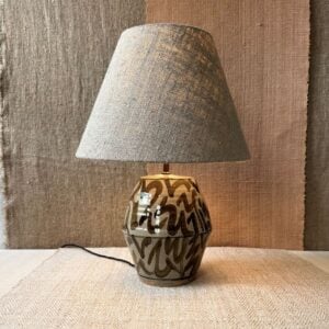 Pottery lamp with a linen shade