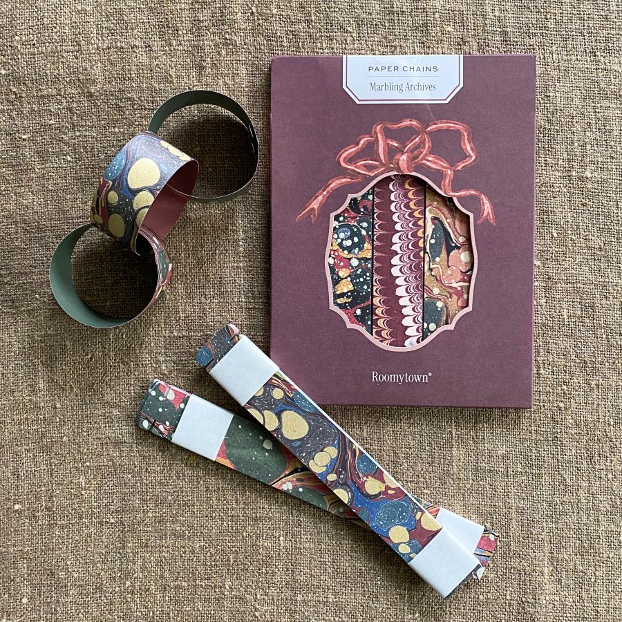 Pack of marbled paper chains on a cloth background