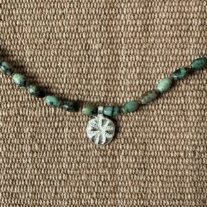 Primitive cross and turquoise necklace