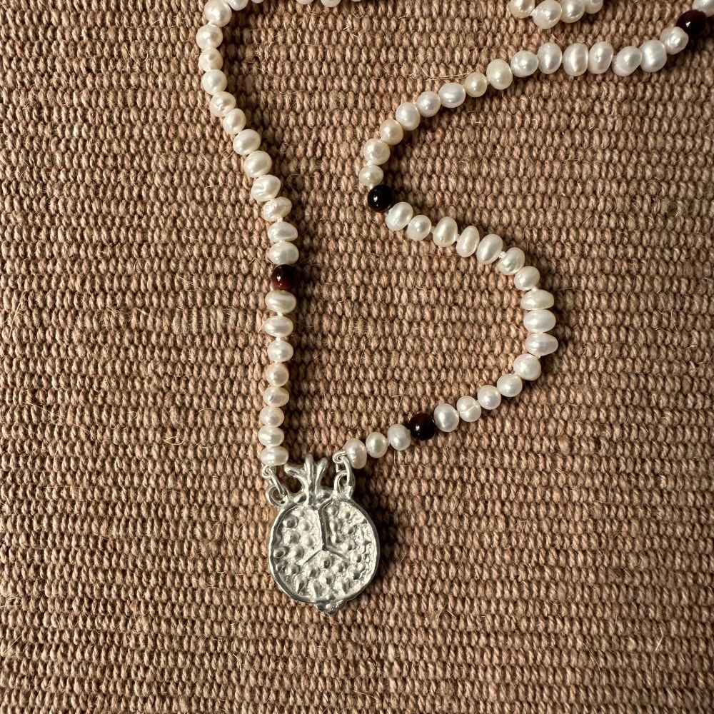 A seed pearl and red tigers eye necklace with